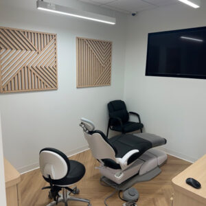 Modern orthodontic treatment room with patient chair