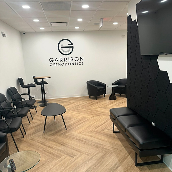 Garrison Orthodontics lobby with branded signage in West Orange, NJ