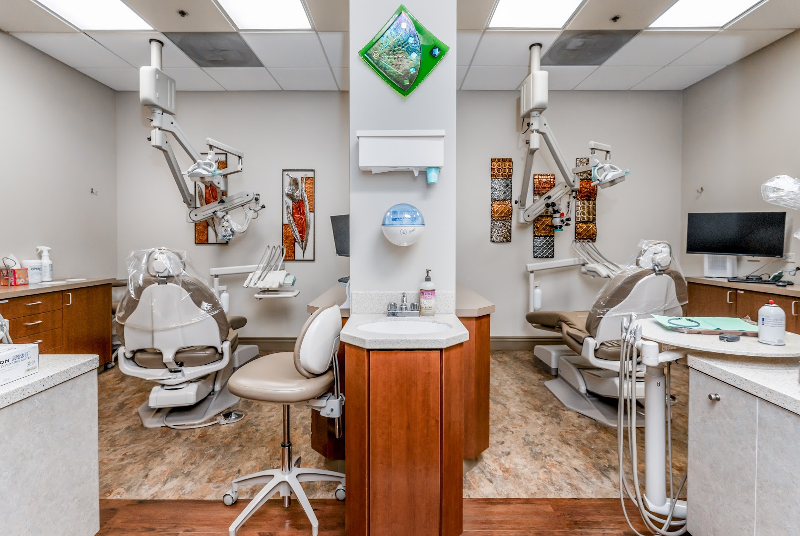 Endodontic treatment bay with dental chairs and equipment