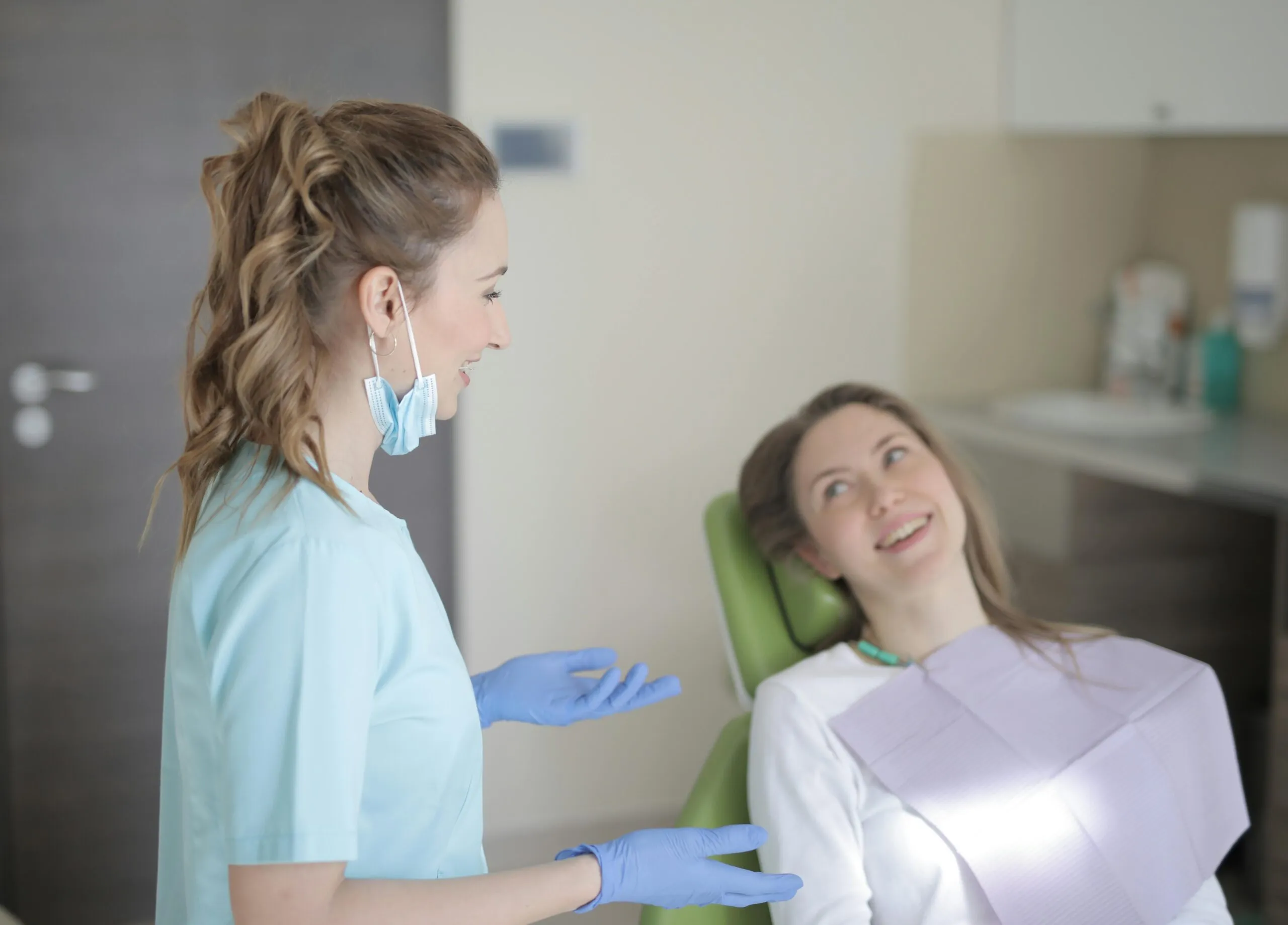 Smiling young patient in dental chair at Artful Orthodontics