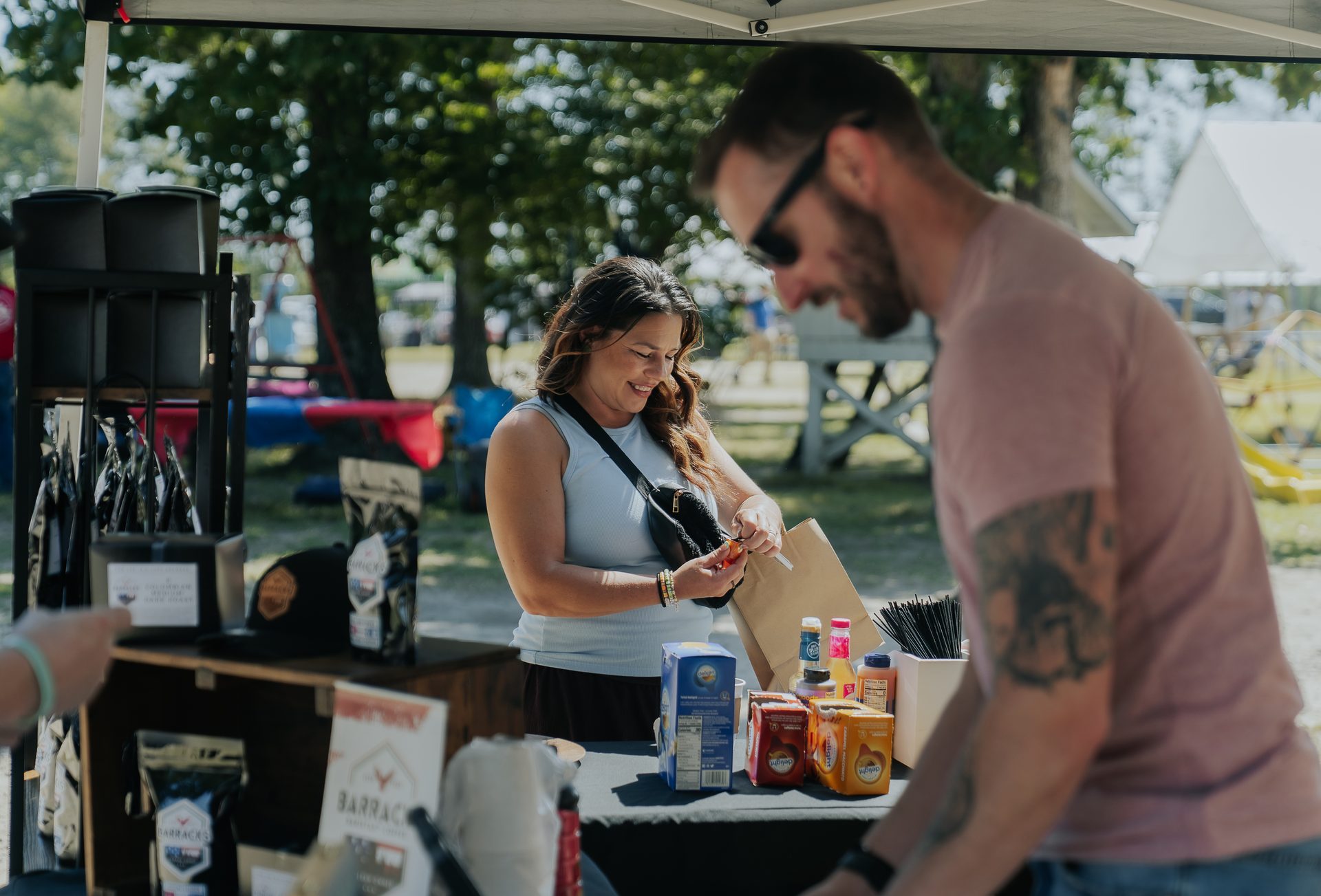 Volunteers at a vendor tent during a Rural Salute event