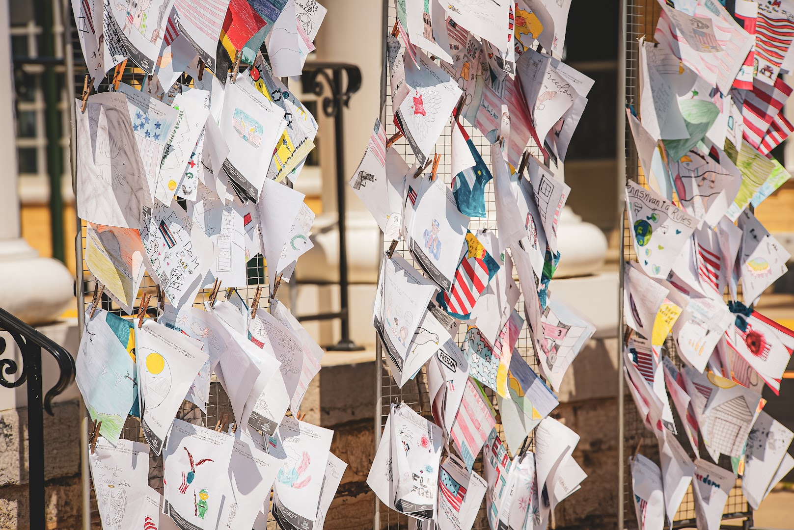 Children's patriotic artwork displayed at a Rural Salute event