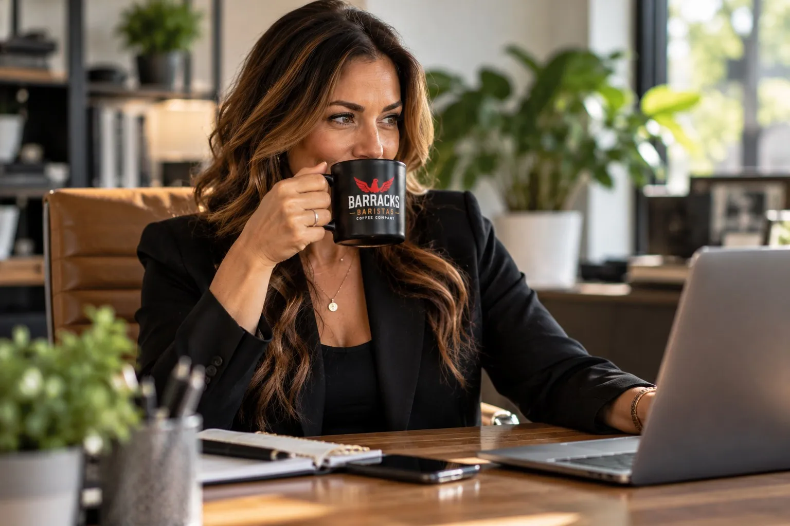 A woman taking a coffee break at her contemporary workspace
